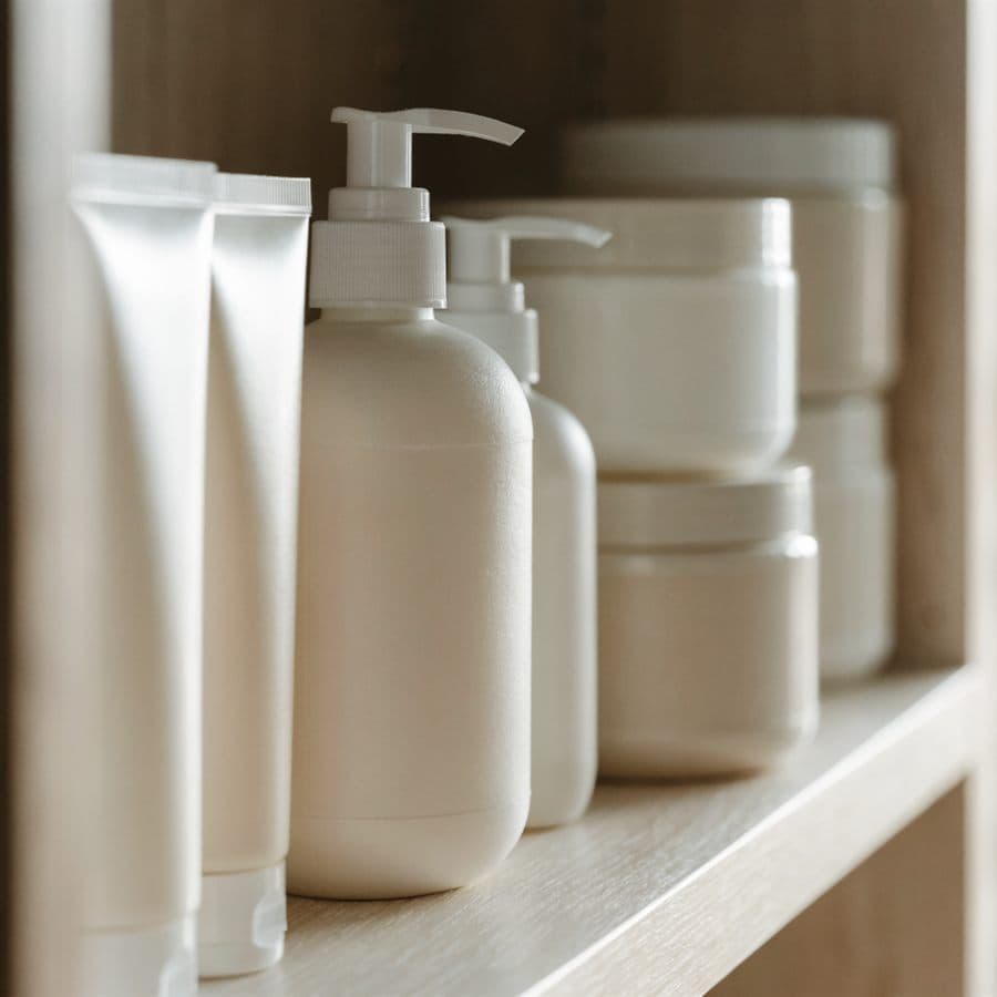 Health and beauty shelf with plain unlabelled tubes and jars